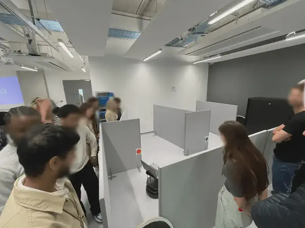 Students testing their solution to the group project in the real-world